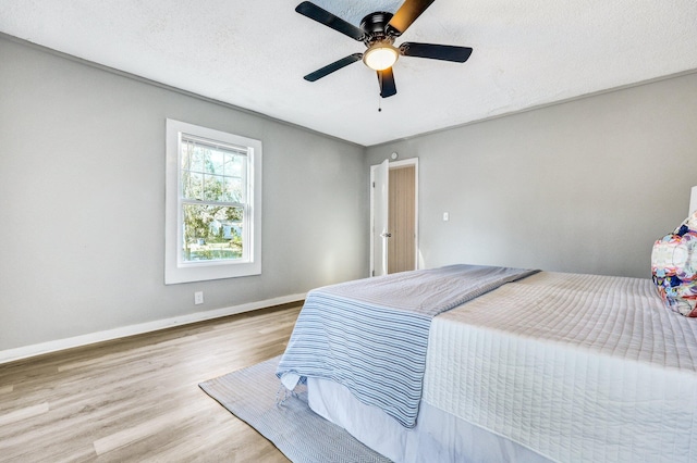 2674 Houston St, North Charleston, SC 29405 - bedroom with wood finished floors, baseboards, and a ceiling fan
