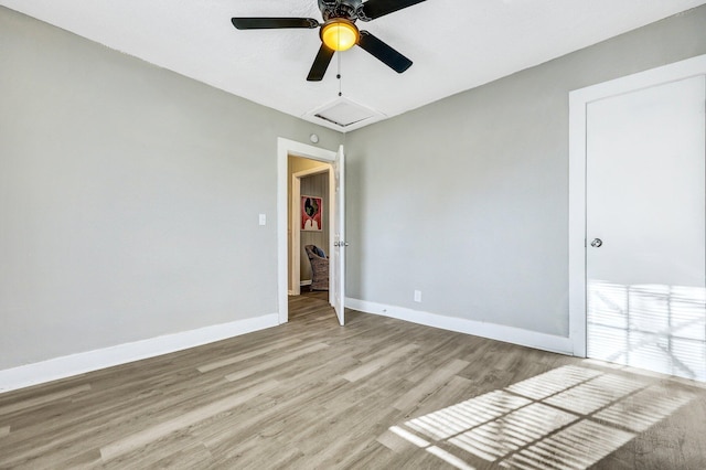2674 Houston St, North Charleston, SC 29405 - spare room featuring light wood-style flooring, a ceiling fan, baseboards, and attic access