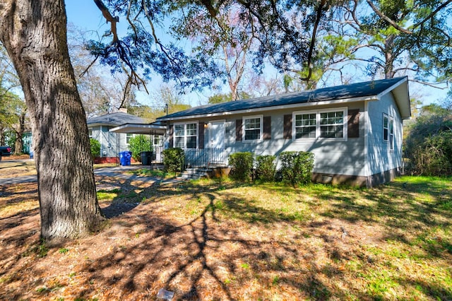 ranch-style home with a front lawn