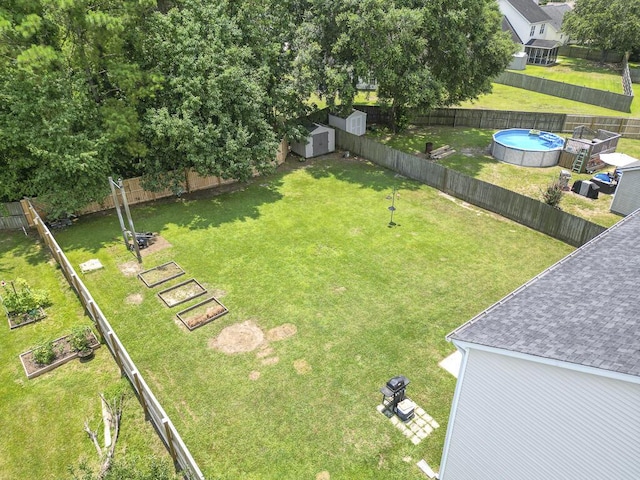 1350 Pinyon Pine Dr, Ladson, SC 29456 - fenced backyard with a storage unit and a garden