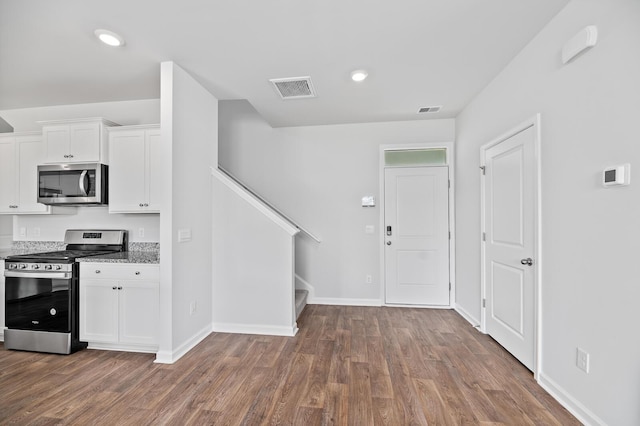 491 Cedarview Rd, Summerville, SC 29486 - kitchen with stainless steel appliances, wood finished floors, white cabinets, baseboards, and recessed lighting