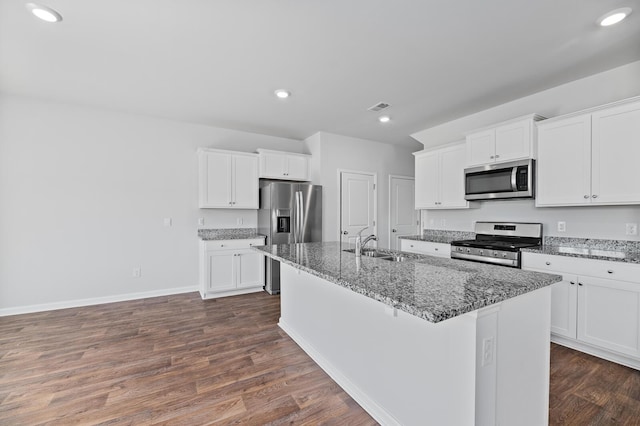 491 Cedarview Rd, Summerville, SC 29486 - kitchen with appliances with stainless steel finishes, a sink, dark wood-type flooring, a center island with sink, and stone countertops