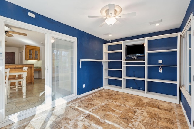 spare room featuring ceiling fan