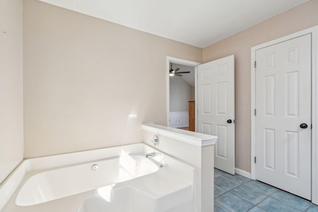 bathroom featuring a garden tub and tile patterned floors