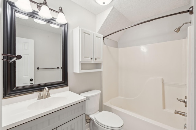 bathroom featuring lofted ceiling, toilet, a textured ceiling, shower / tub combination, and vanity