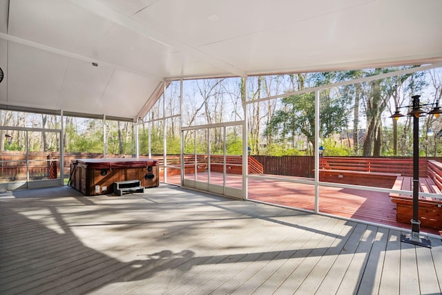 sunroom with lofted ceiling and a wealth of natural light