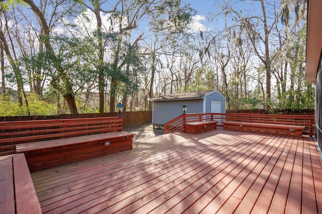 deck with fence and an outdoor structure