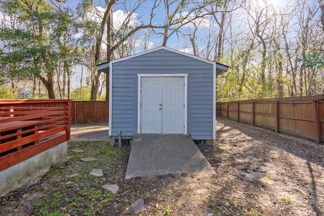 view of shed with a fenced backyard