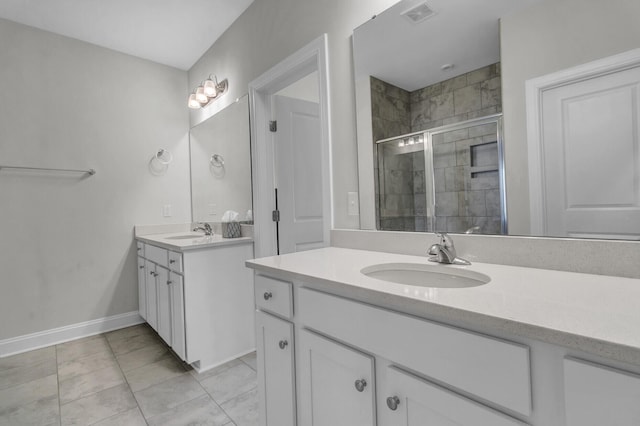 bathroom featuring vanity and a shower with door