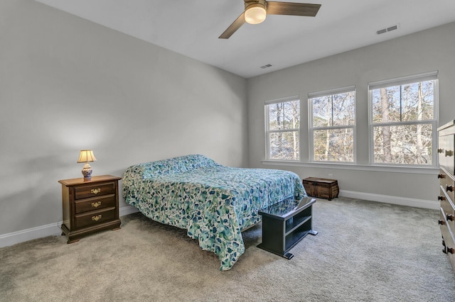 bedroom with ceiling fan and carpet