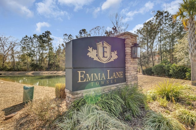 community sign with a water view