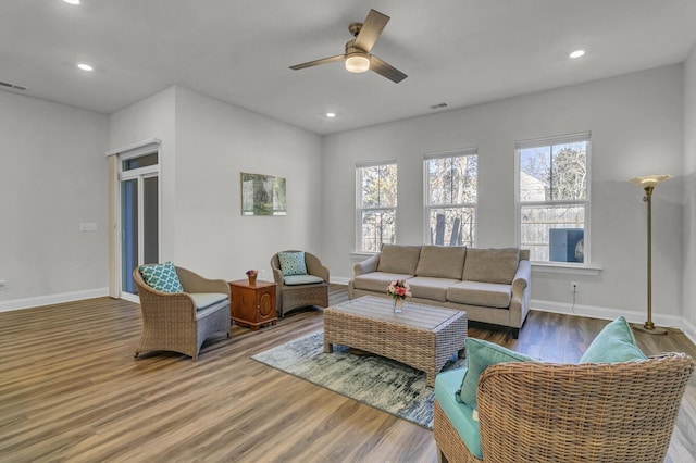 living room with hardwood / wood-style floors and ceiling fan