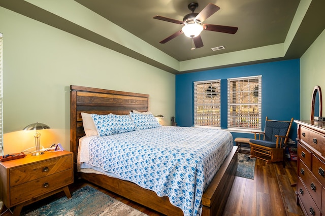 212 Chester Ln, Cottageville, SC 29435 - bedroom featuring a ceiling fan, a raised ceiling, dark wood-type flooring, and visible vents