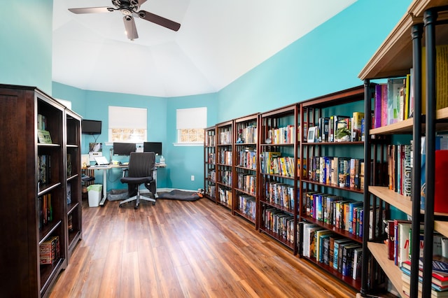212 Chester Ln, Cottageville, SC 29435 - office space with vaulted ceiling, wood finished floors, baseboards, ceiling fan, and wall of books