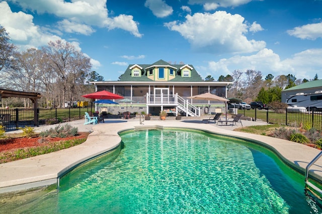 212 Chester Ln, Cottageville, SC 29435 - view of swimming pool with a sunroom, fence, and a patio