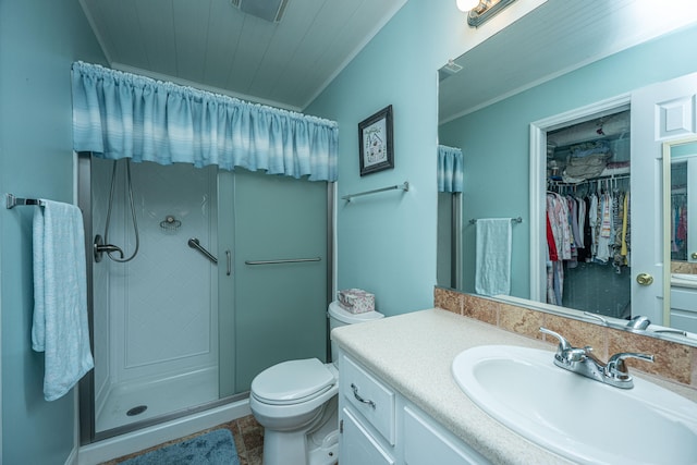 bathroom featuring tile patterned floors, vanity, an enclosed shower, and toilet