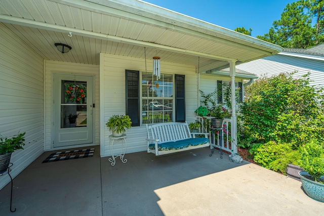 doorway to property featuring a porch