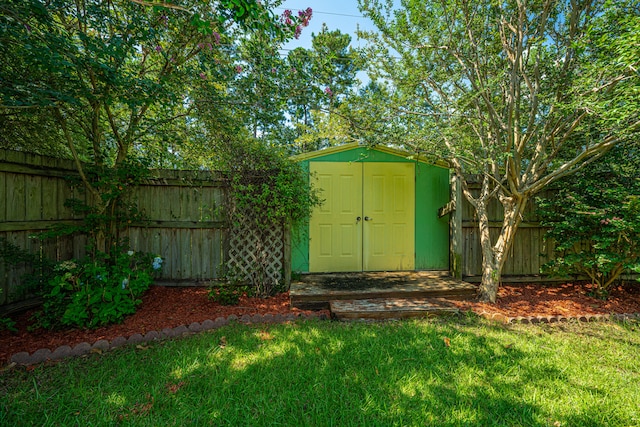 view of outdoor structure with a lawn