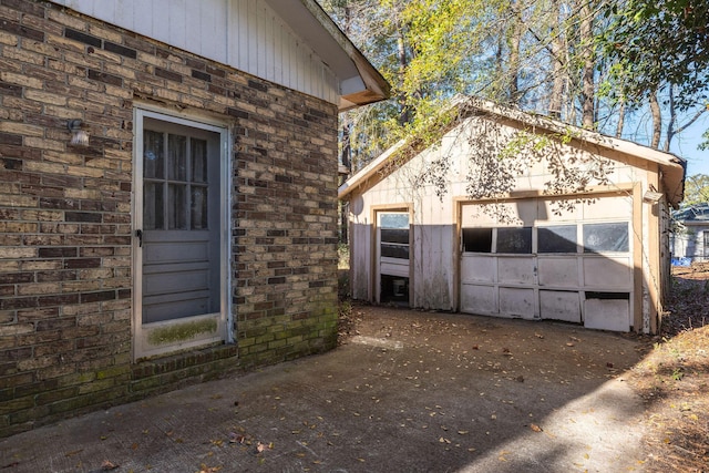 exterior space with a garage and an outdoor structure