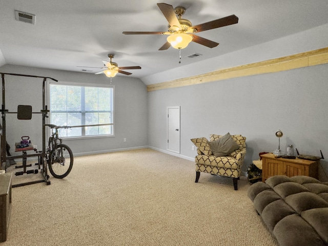 living area featuring lofted ceiling and light carpet