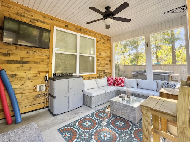 sunroom / solarium featuring ceiling fan and wooden ceiling