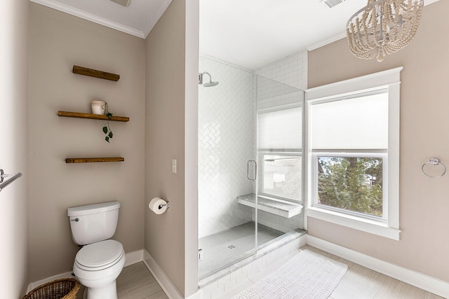 full bath with baseboards, toilet, a stall shower, ornamental molding, and a chandelier