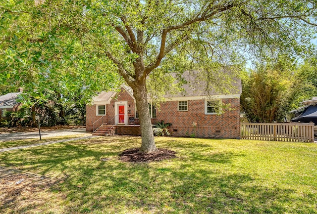 ranch-style house with brick siding, a front yard, and crawl space