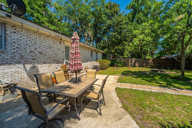 5302 Helene Dr, North Charleston, SC 29418 - fenced backyard with outdoor dining space and a patio area