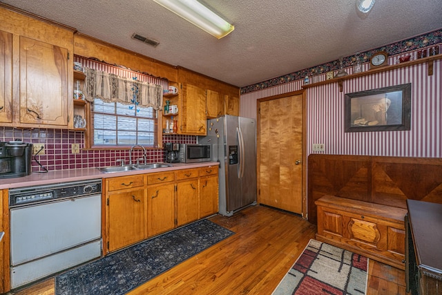 5302 Helene Dr, North Charleston, SC 29418 - kitchen featuring appliances with stainless steel finishes, open shelves, a textured ceiling, light countertops, and light wood finished floors