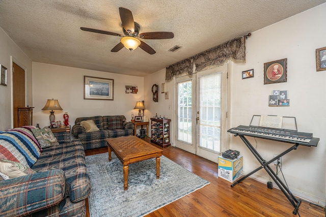 5302 Helene Dr, North Charleston, SC 29418 - living room with a textured ceiling, a ceiling fan, and wood finished floors