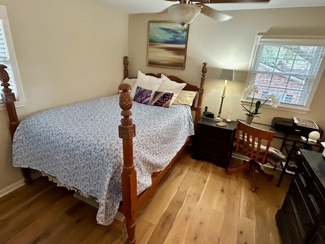 bedroom featuring wood-type flooring and ceiling fan