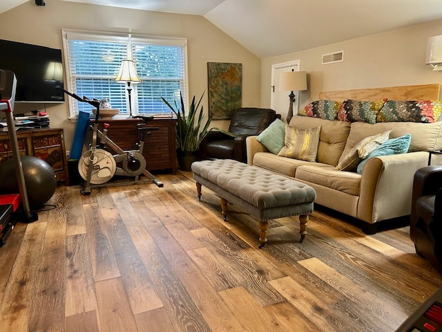 living room with lofted ceiling and wood-type flooring