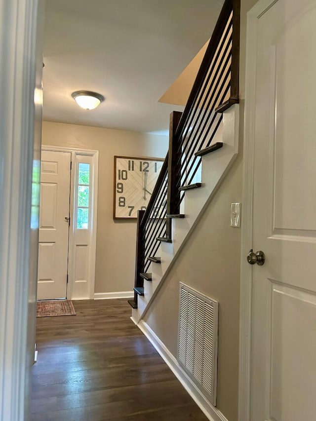 foyer entrance featuring dark hardwood / wood-style floors