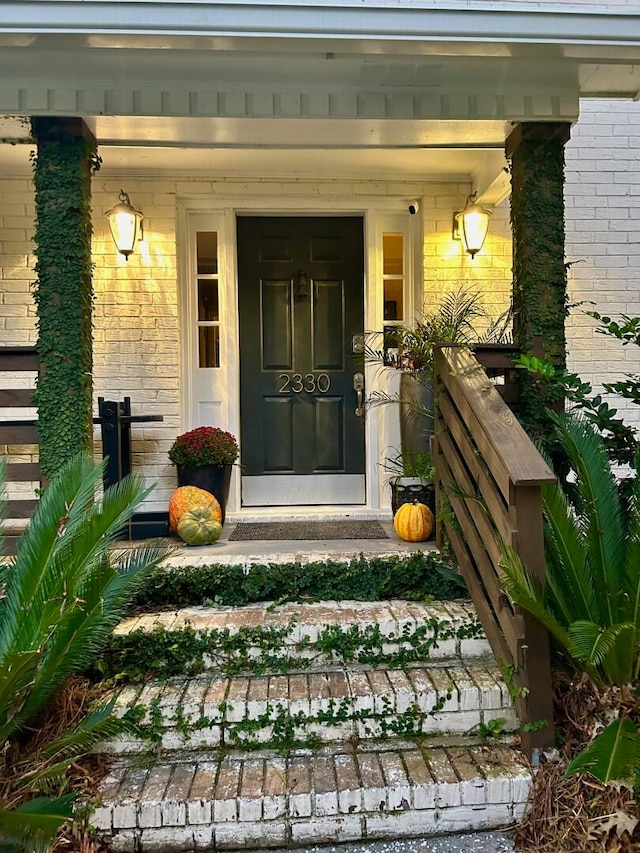 doorway to property with a porch