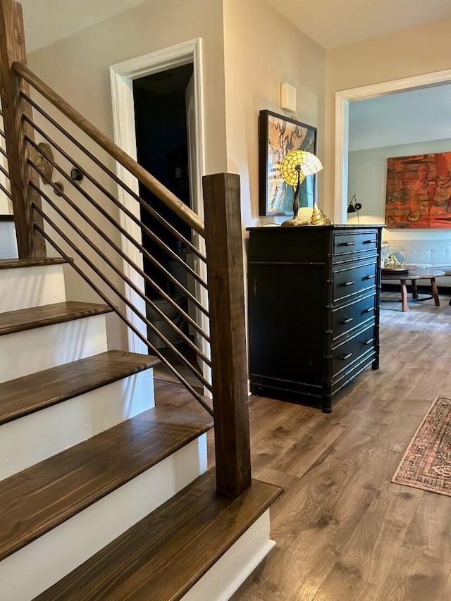 stairway featuring hardwood / wood-style flooring