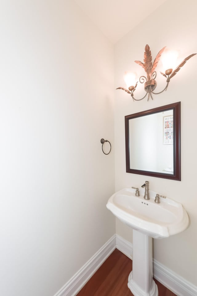 bathroom featuring baseboards and wood finished floors