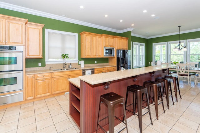 kitchen featuring a kitchen island, stainless steel appliances, a sink, and a warming drawer