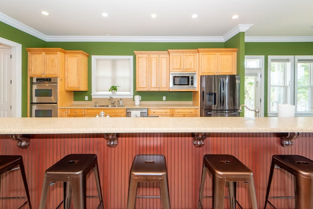 kitchen featuring dishwasher, ornamental molding, sink, and light tile patterned flooring