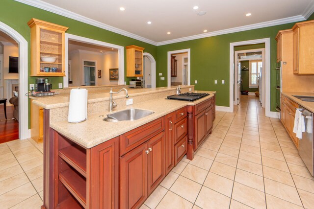 living room with built in features, hardwood / wood-style floors, ceiling fan, and ornamental molding