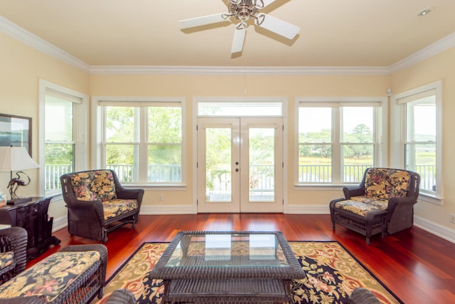 empty room featuring crown molding, ceiling fan, and wood-type flooring