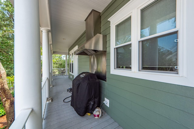 wooden deck with a porch and grilling area