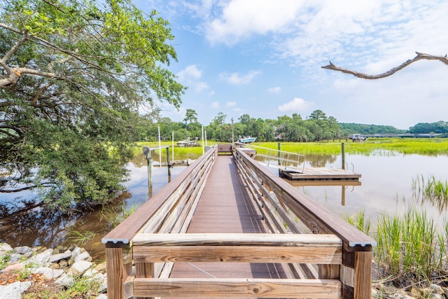 dock area featuring a water view