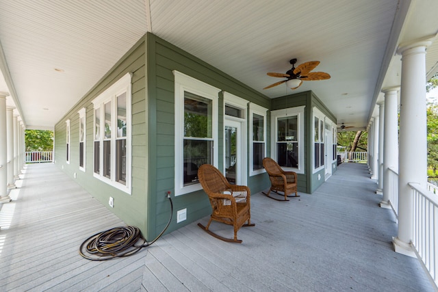 wooden deck with ceiling fan and a porch