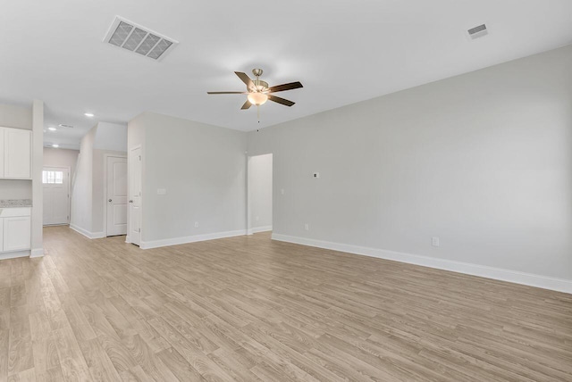 224 Young Town Cir, Orangeburg, SC 29118 - unfurnished living room featuring light wood-type flooring, visible vents, a ceiling fan, and baseboards