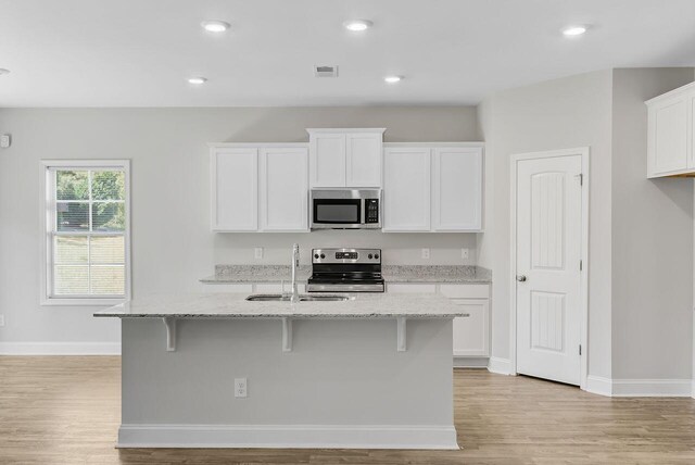 224 Young Town Cir, Orangeburg, SC 29118 - kitchen with light wood-style flooring, stainless steel appliances, visible vents, and a sink
