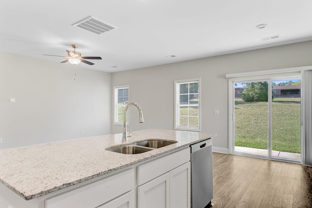 224 Young Town Cir, Orangeburg, SC 29118 - kitchen featuring stainless steel dishwasher, a sink, light wood-type flooring, visible vents, and an island with sink