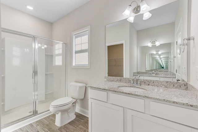 224 Young Town Cir, Orangeburg, SC 29118 - bathroom with a chandelier, a shower stall, toilet, and wood finished floors