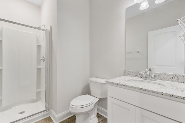 224 Young Town Cir, Orangeburg, SC 29118 - full bathroom with a shower stall, baseboards, toilet, and wood finished floors