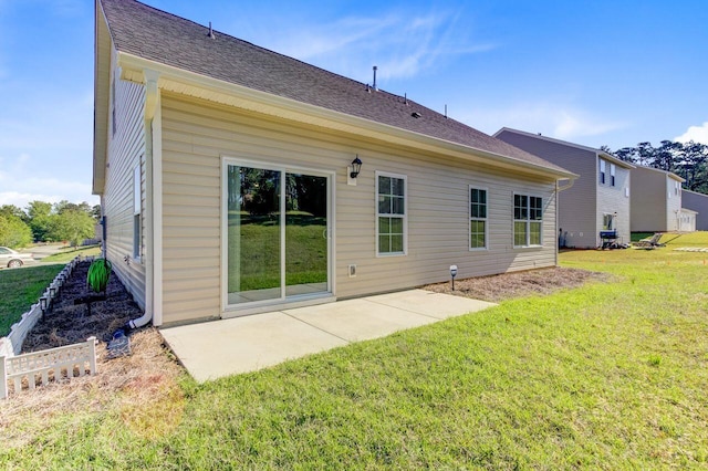 224 Young Town Cir, Orangeburg, SC 29118 - rear view of property featuring a lawn, roof with shingles, and a patio