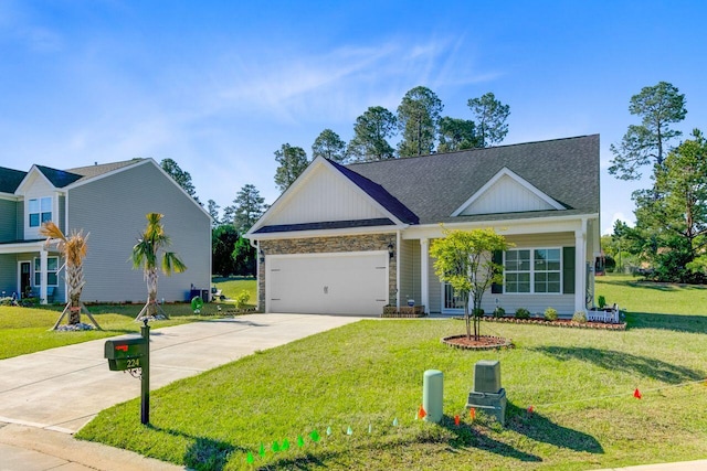 224 Young Town Cir, Orangeburg, SC 29118 - view of front of property with driveway, stone siding, an attached garage, a front yard, and roof with shingles